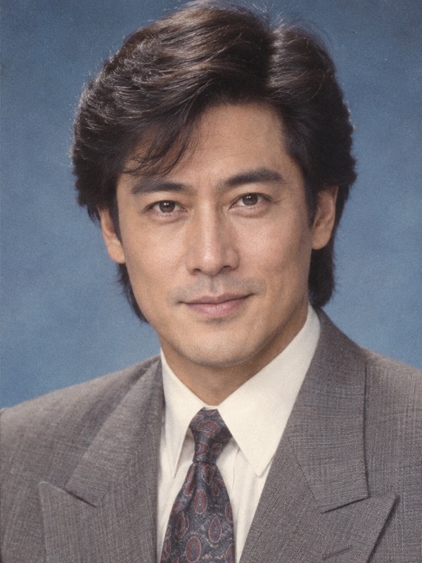 The same East Asian man in the same pose with a fuller side part and a vintage suit in an 80s portrait