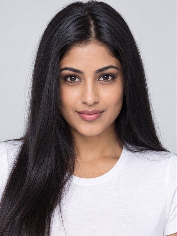 Modern portrait of a South Asian woman with sleek black hair and a white shirt